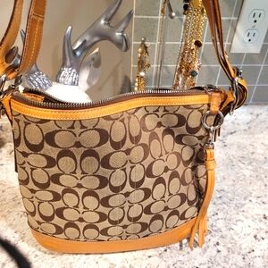 COACH Purse shoulder bag pulling at handles